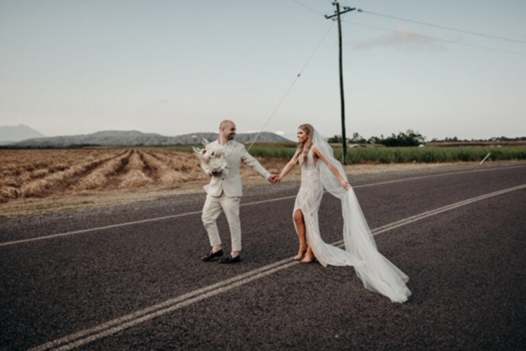 wedding photography of a couple crossing the road