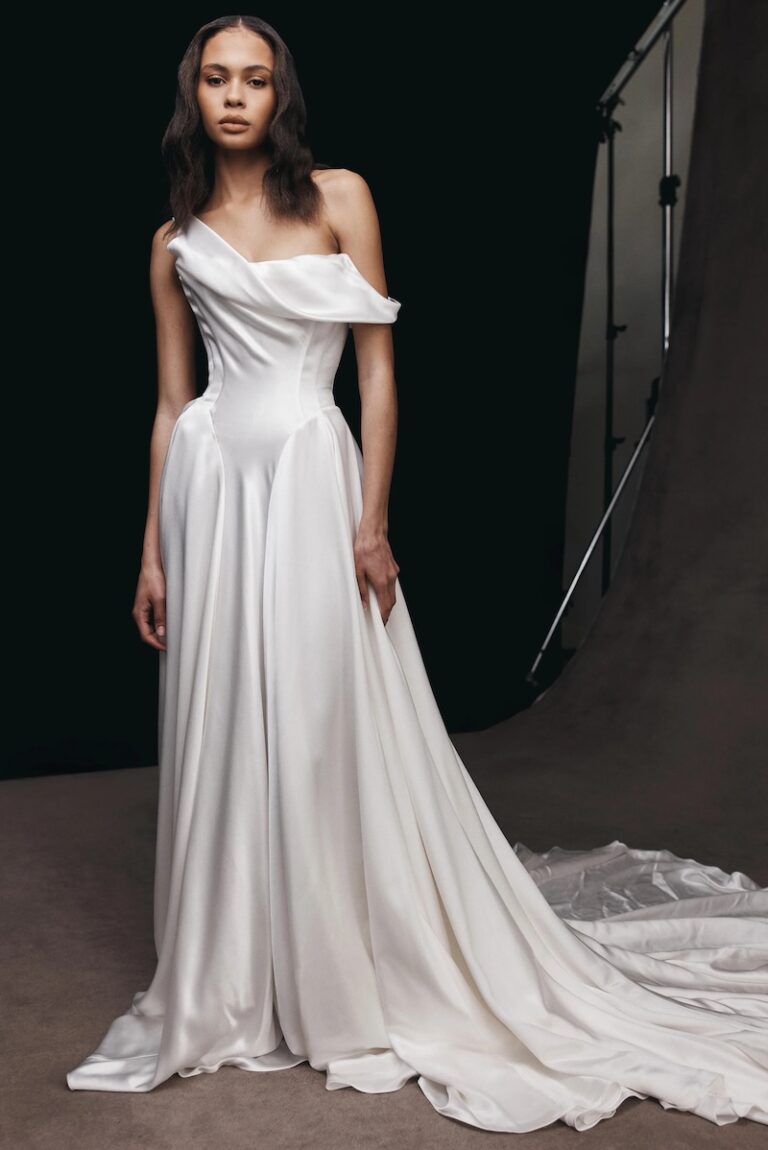 A bride in a draped white silk wedding gown