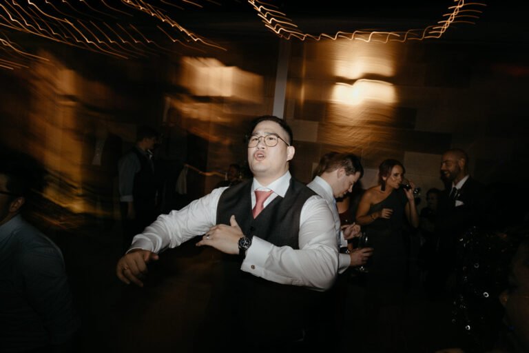 the groom dancing at the wedding afterparty