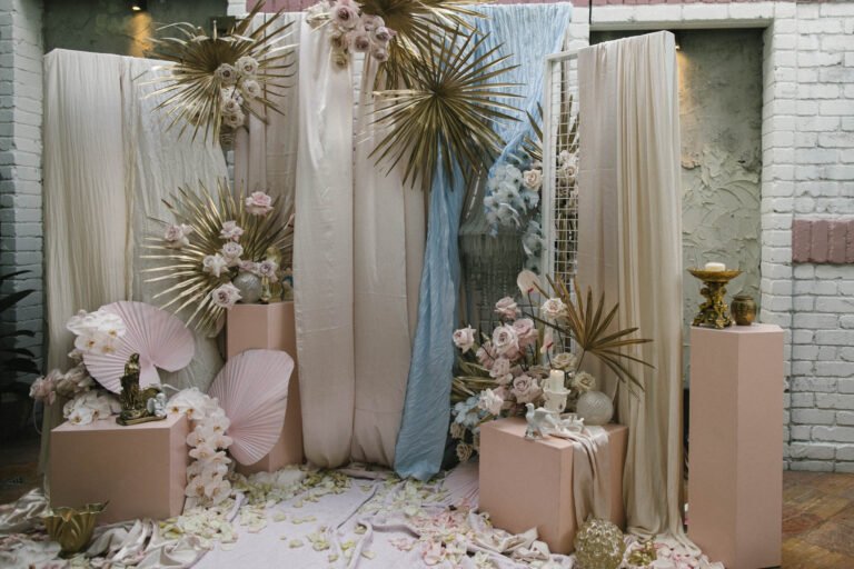a beautiful wedding backdrop featuring elegant pink and gold decorations, creating a romantic atmosphere for a wedding