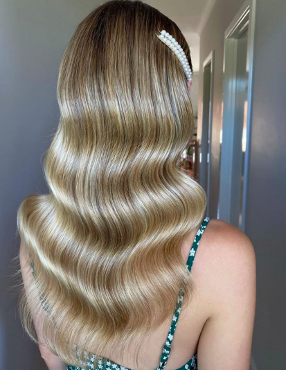 a photo of a woman with a wedding waves hairstyle
