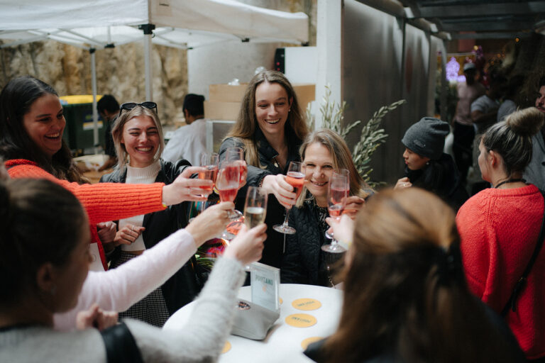 people drinking wine at a wedding fair