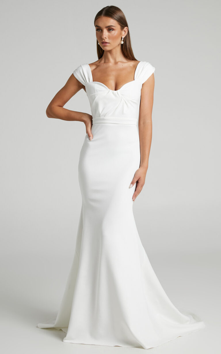 Bride in a white gown showcasing one of the best wedding dresses under $500.