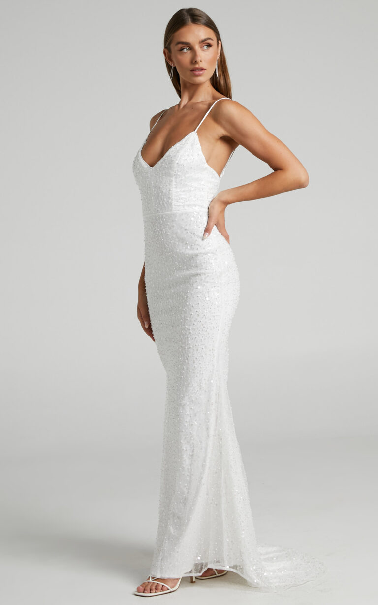 Elegant bride in a white strappy V-neck wedding dress from the best wedding dresses under $500 collection.