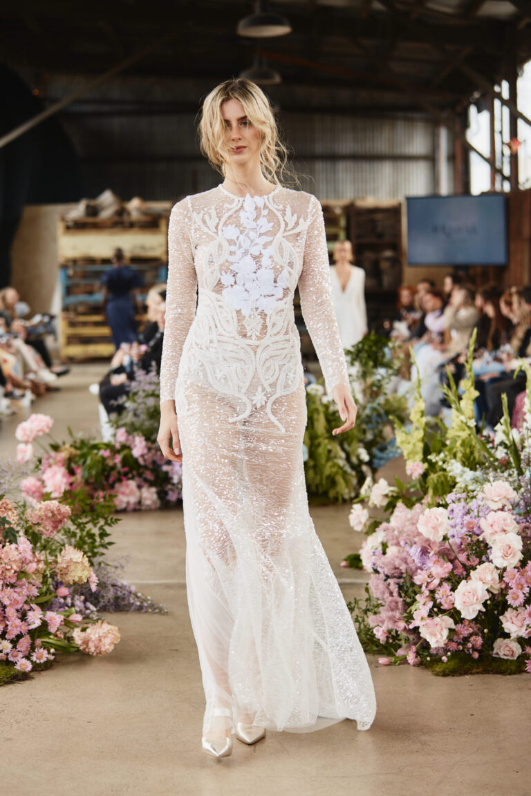 a bride wearing a wedding dress in white