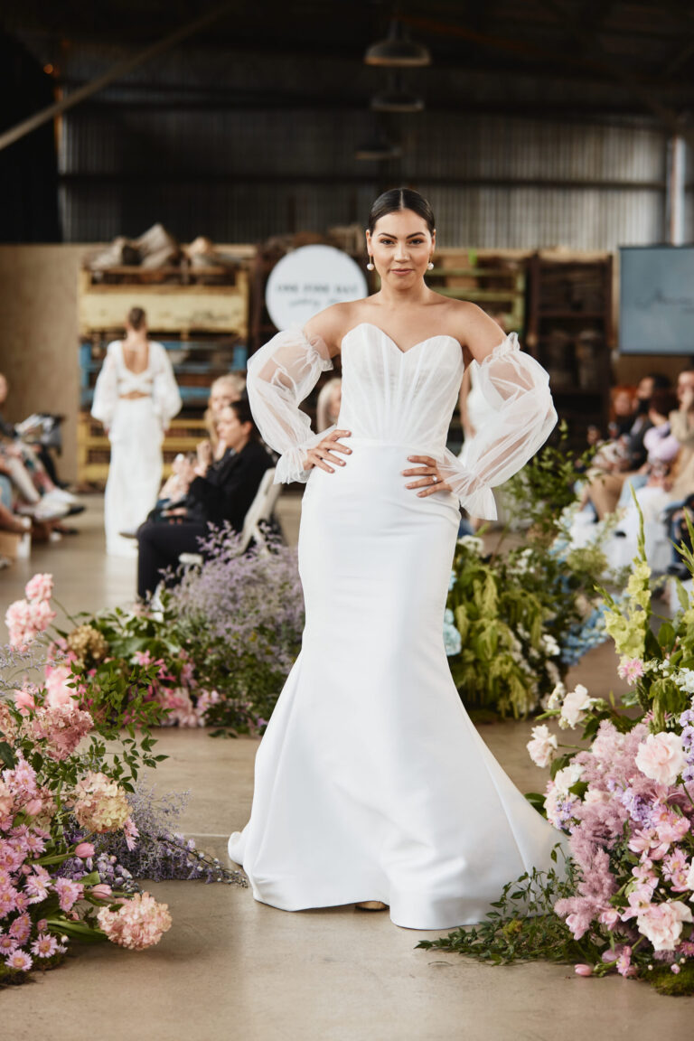 a beautiful woman wearing a lovely wedding dress