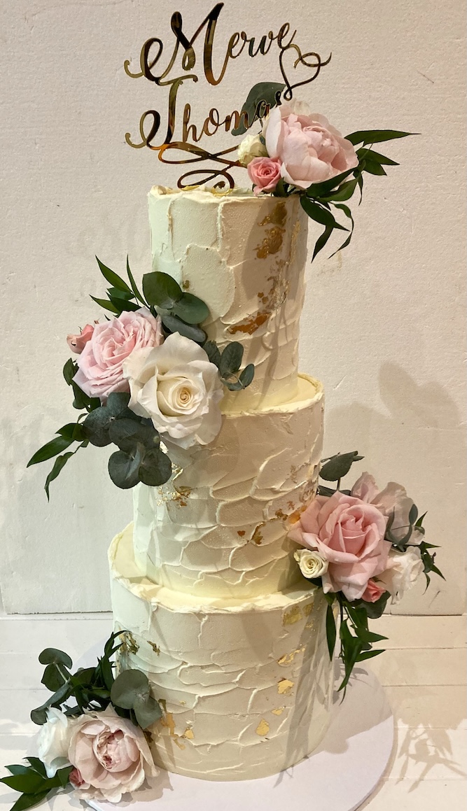 A beautiful floral wedding cake with multiple layers by Sydney wedding cake supplier Cake Chemistry