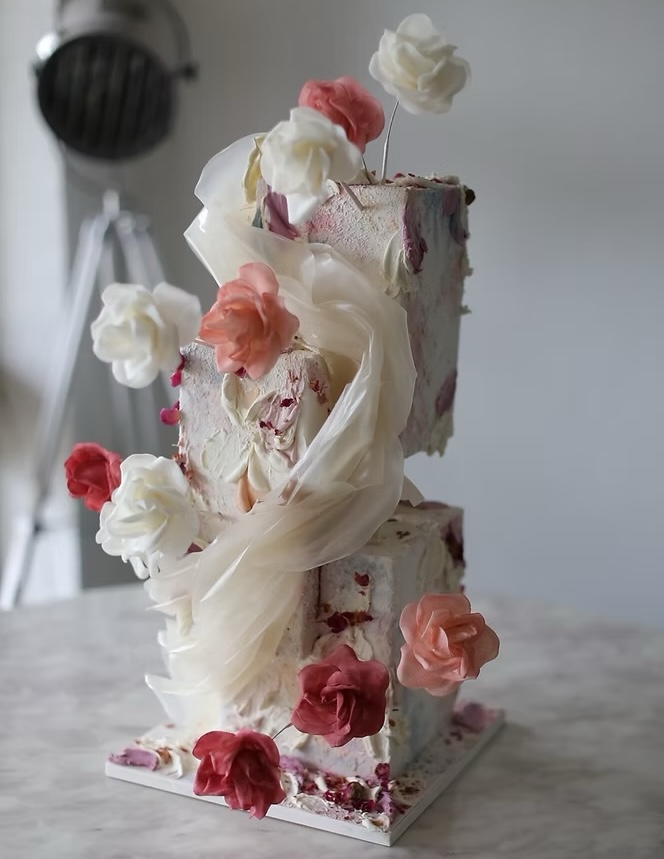 A floral cake with three tiers by Sweet Bloom sydney cake brand