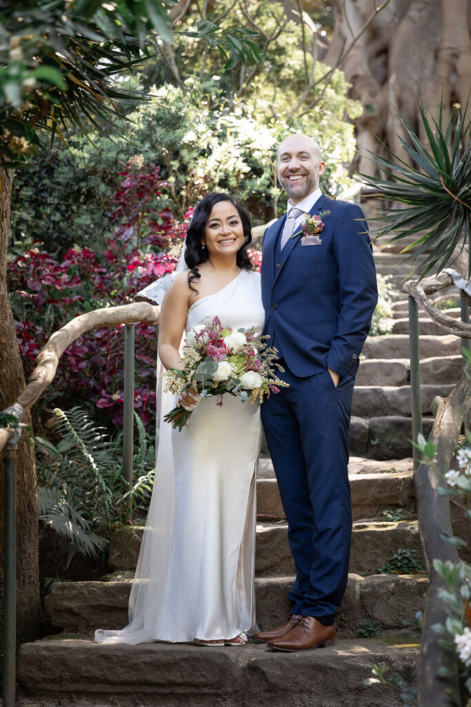 Happy bride and groom at an outdoor wedding venue taken by the best wedding photographers Sydney.