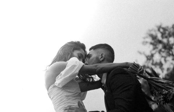 a couple shot by a melbourne wedding photographer in black and white, hugging