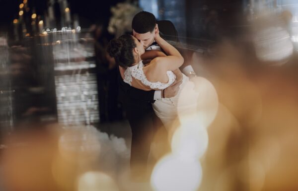 A couple kissing on a dance floor, taken by A sydney wedding photographer