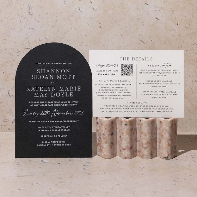 A set of wedding invitation designer made cards set against marble