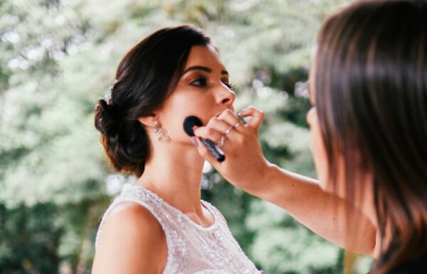 a bride getting her makeup done with wedding day foundation