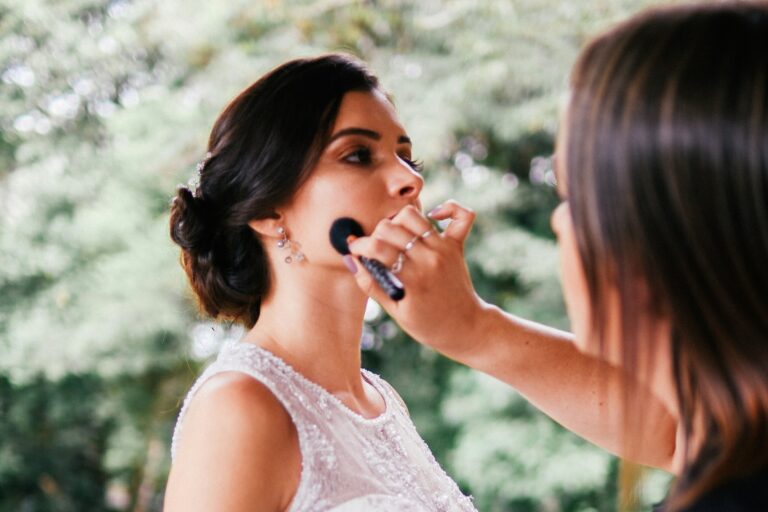 a bride getting her makeup done with wedding day foundation