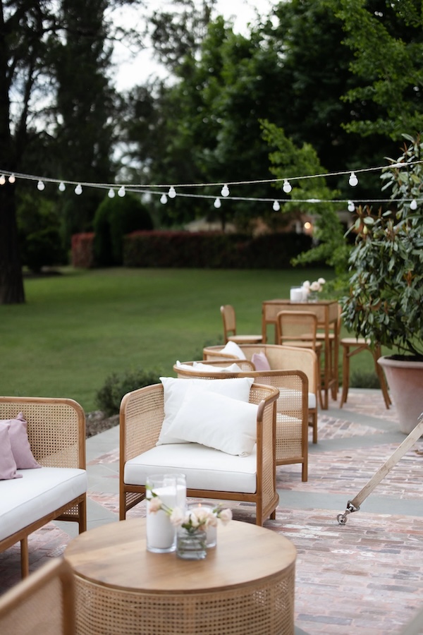 Chairs and tables set up at a garden wedding