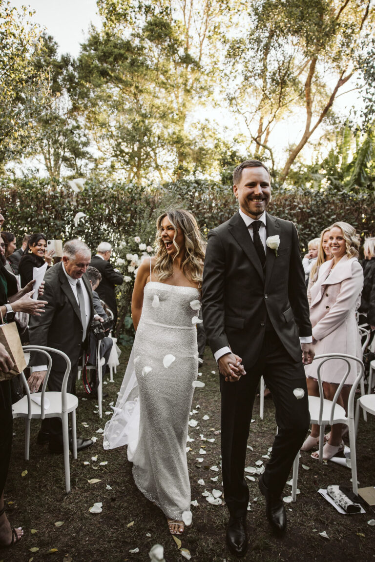 Newlyweds walking down the aisle.