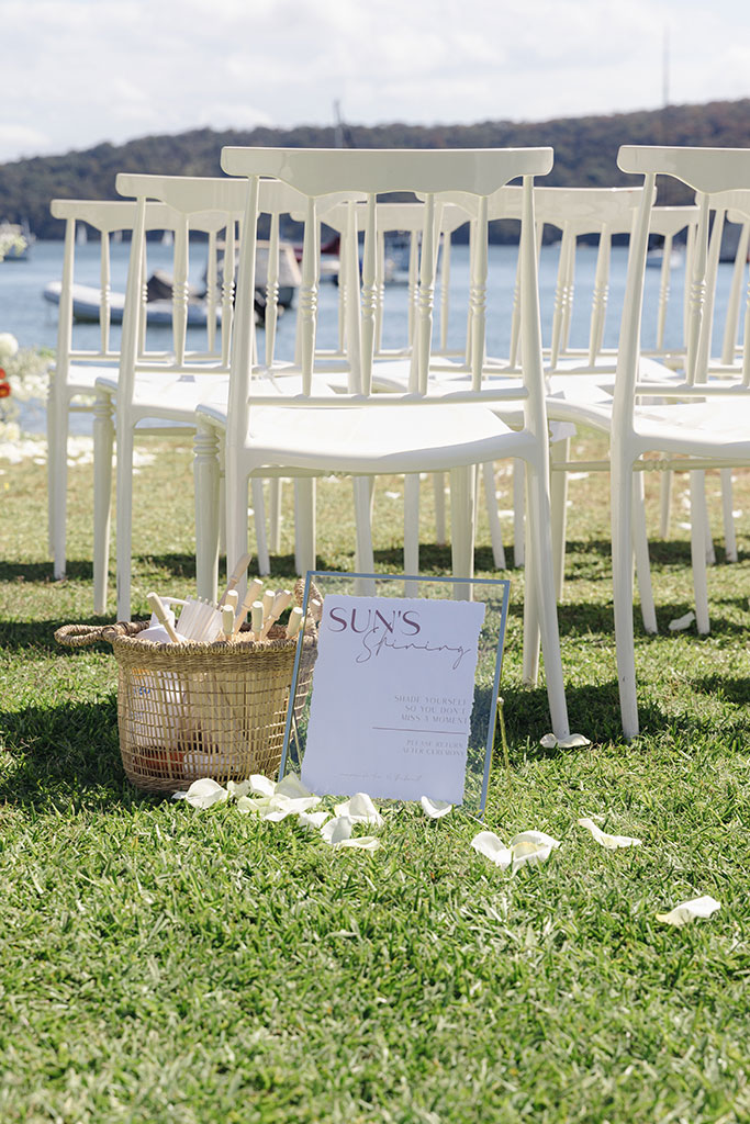 A beautiful beach wedding ceremony with the ocean in the background.