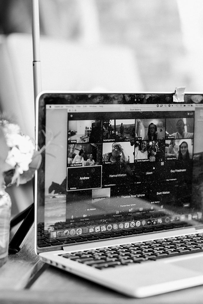 A laptop that shows a zoom call.