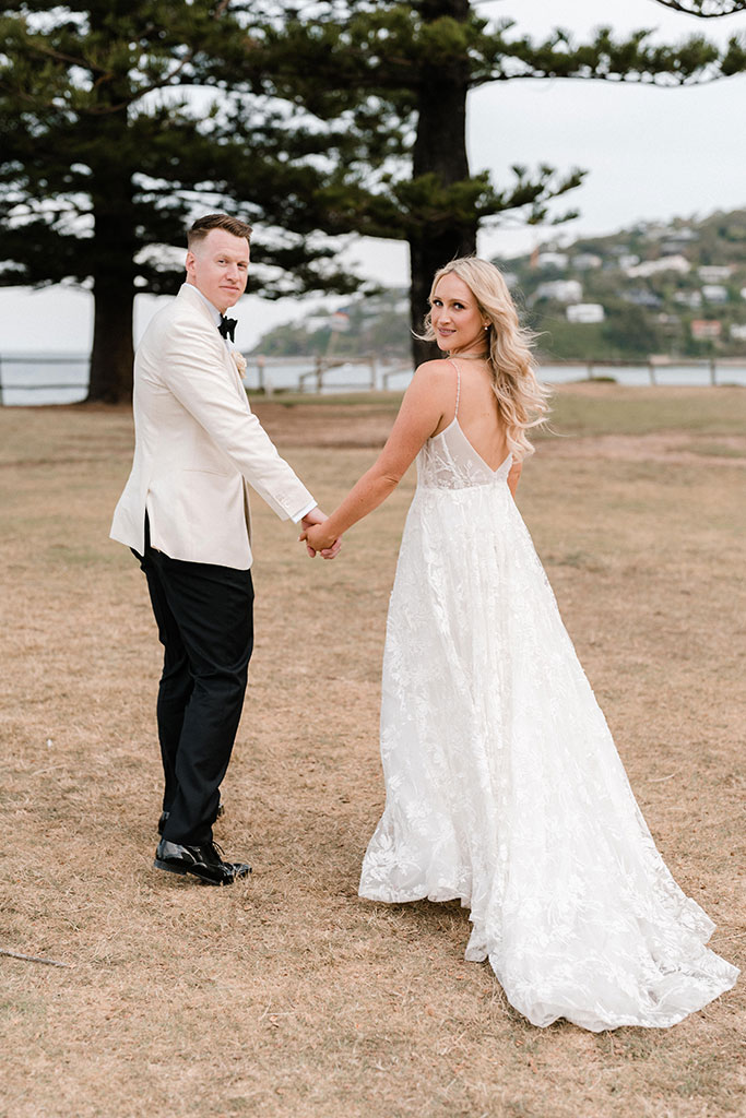 The couple holding hands.