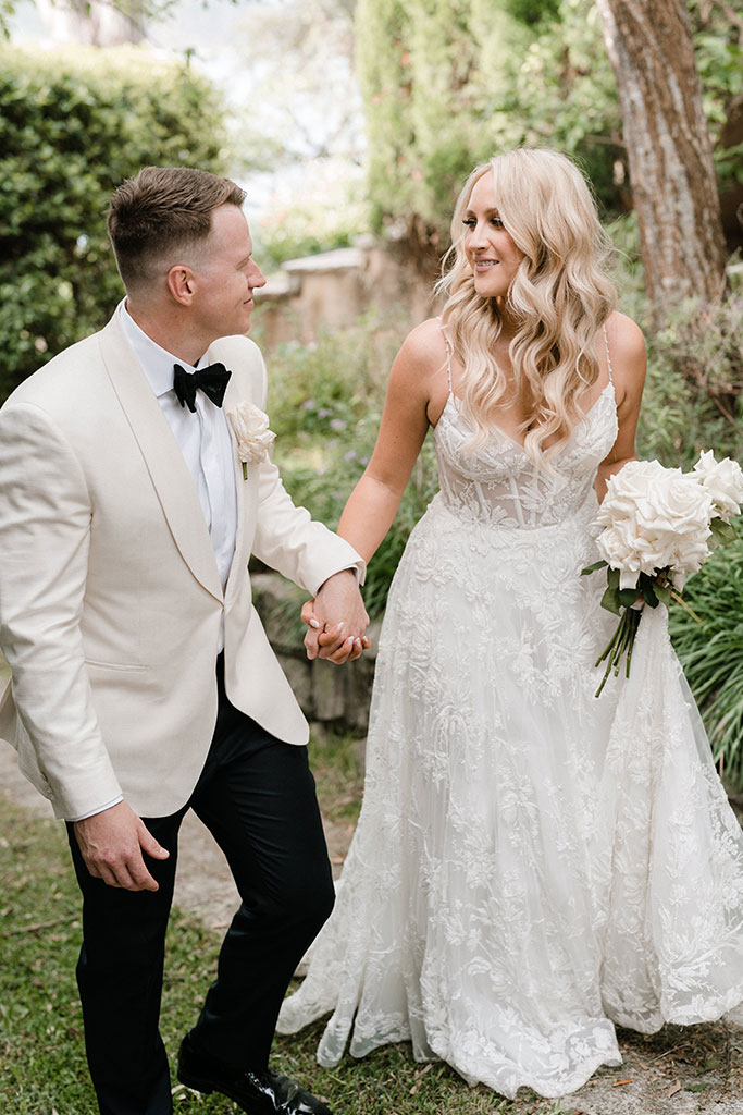 The couple walking together, hand in hand.