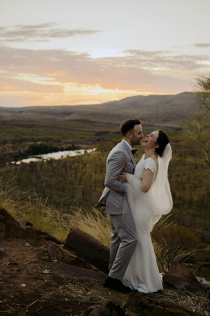 A couple in a beautiful outback landscape.