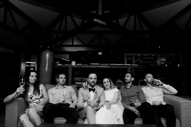People sitting together on a couch.