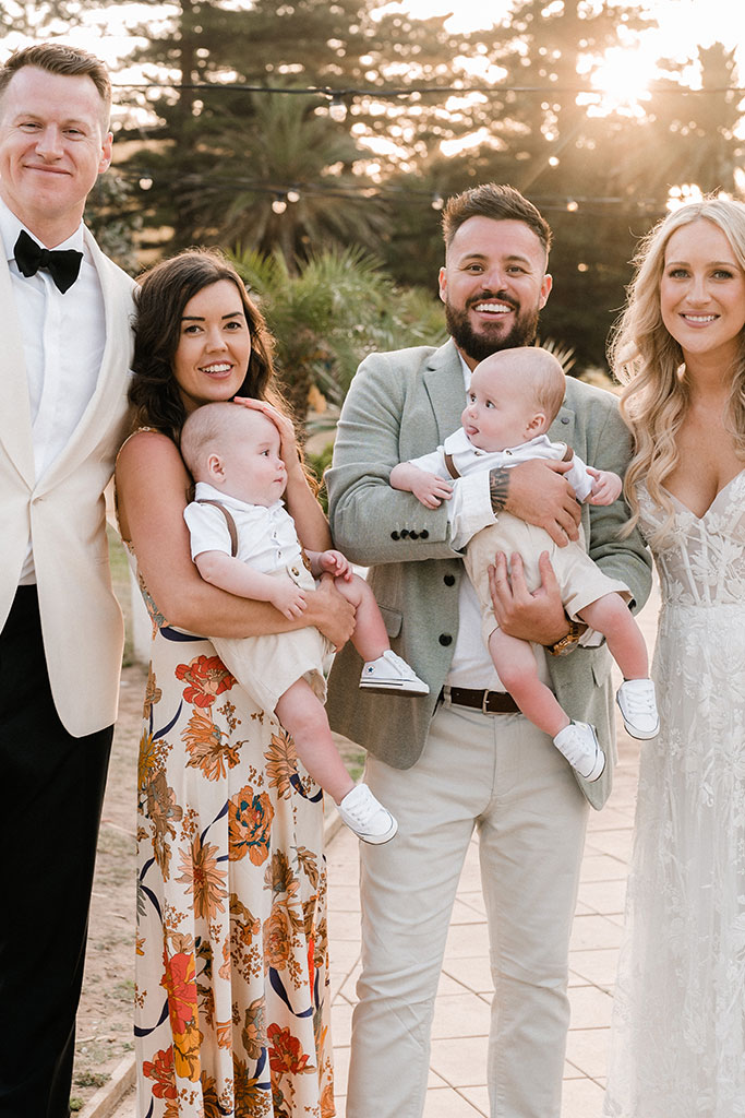 The newlyweds posing a couple with their children.