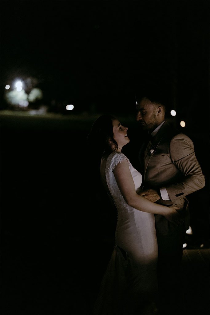 Newlyweds dancing together.