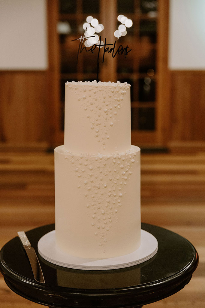 A two layered white wedding cake.
