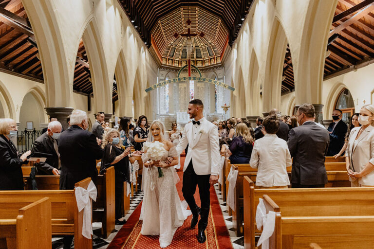 Newly weds walking down the aisle.