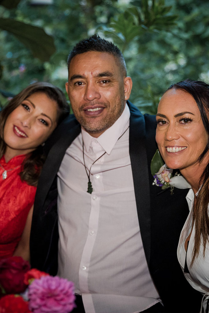 a photo of the bride and groom with their family and friends at their wedding