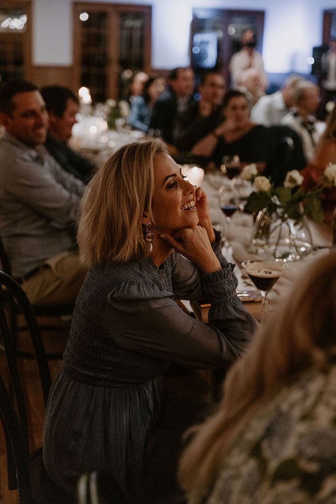 A woman enjoying the wedding reception.