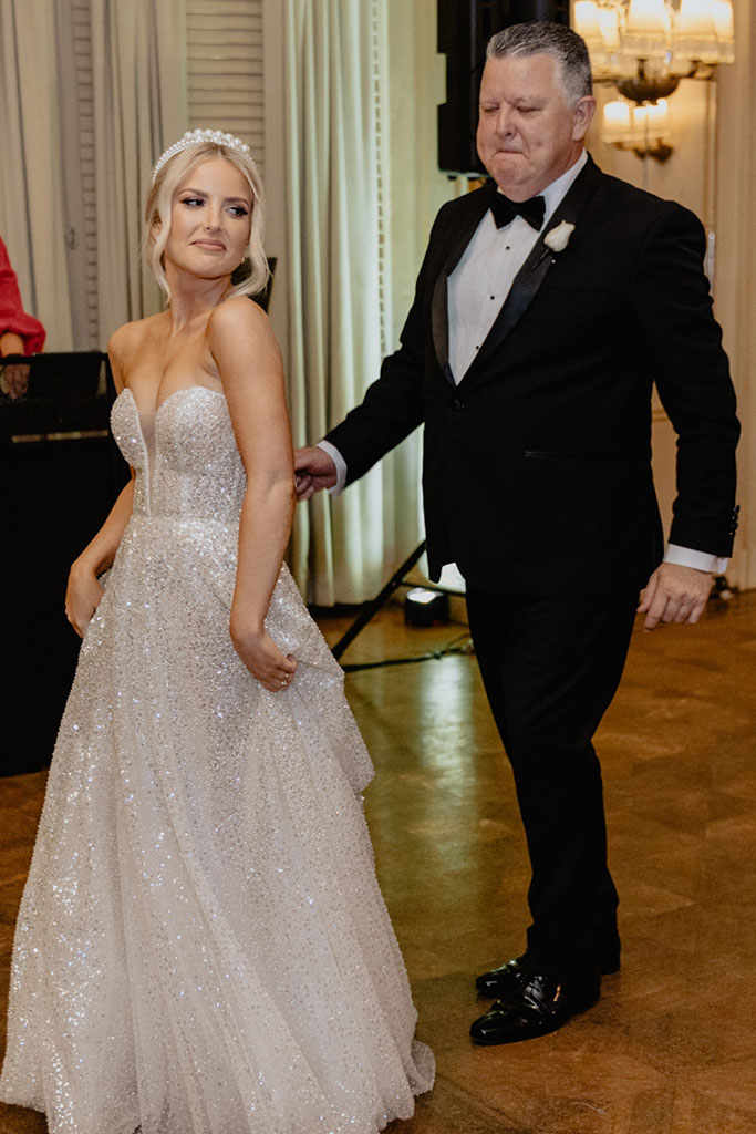 A bride dancing with her father.