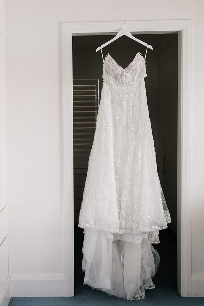 A wedding dress on a hanger.