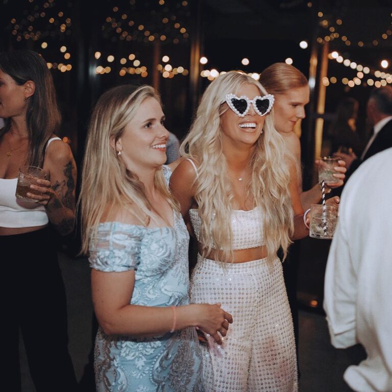 Two women enjoying the party.