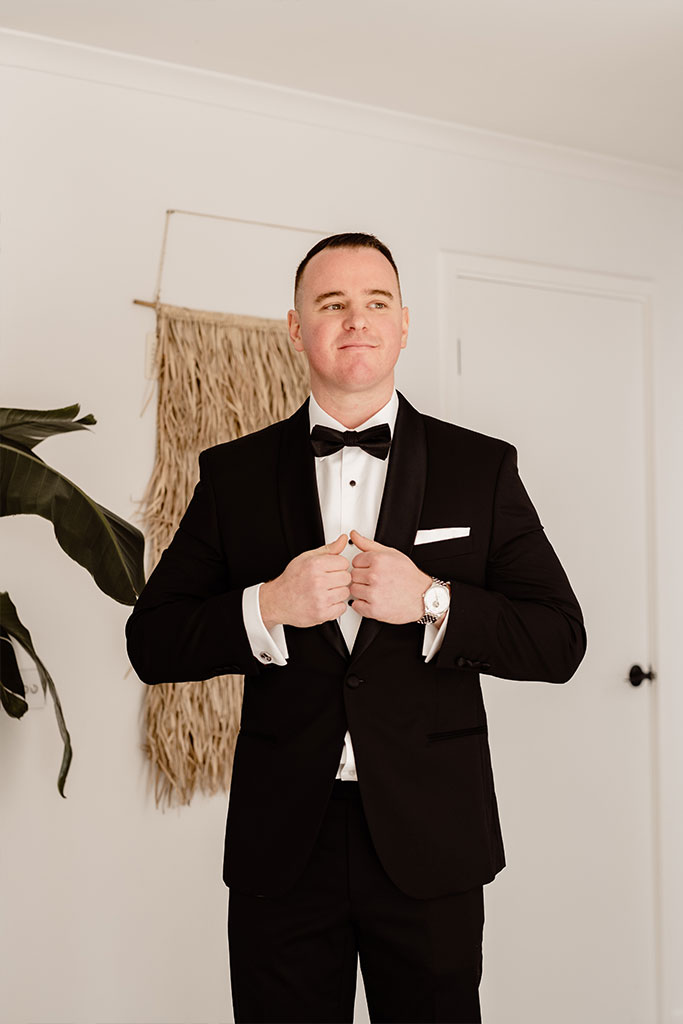 A man wearing tuxedo.