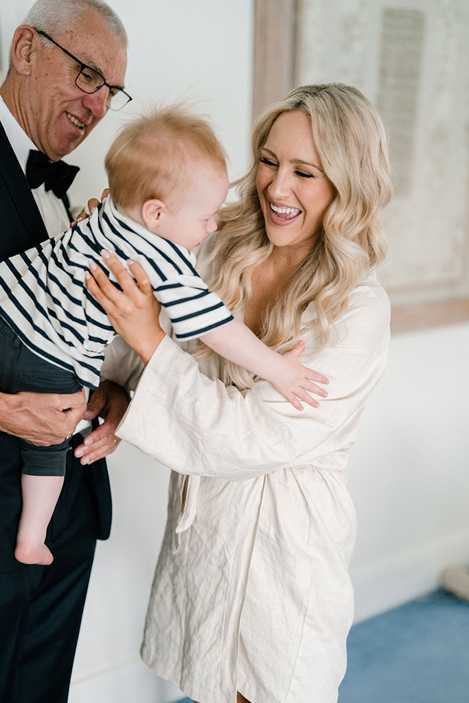 The bride holding a baby.