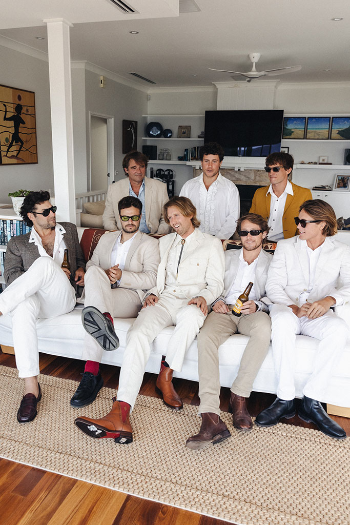 A groom and his groomsmen sitting together.