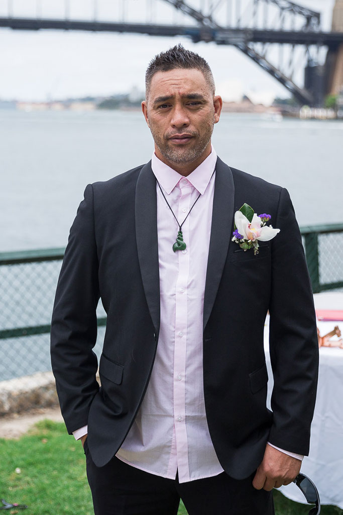 the groom wearing a wedding suit