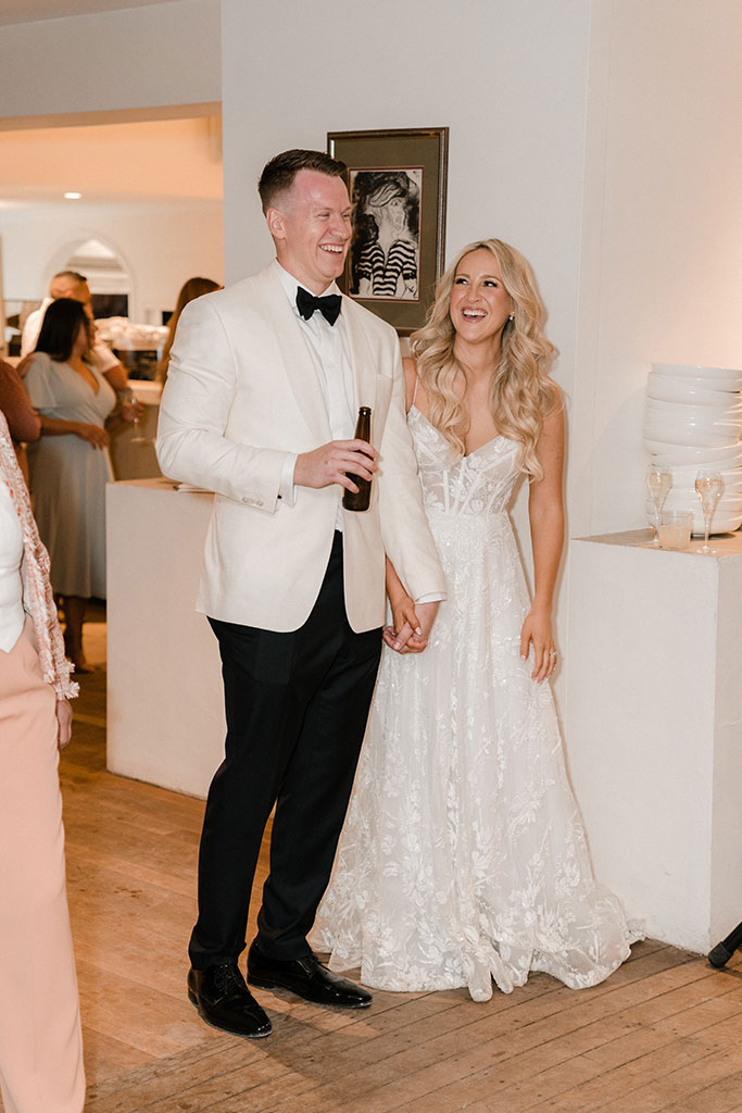 The couple standing together smiling.