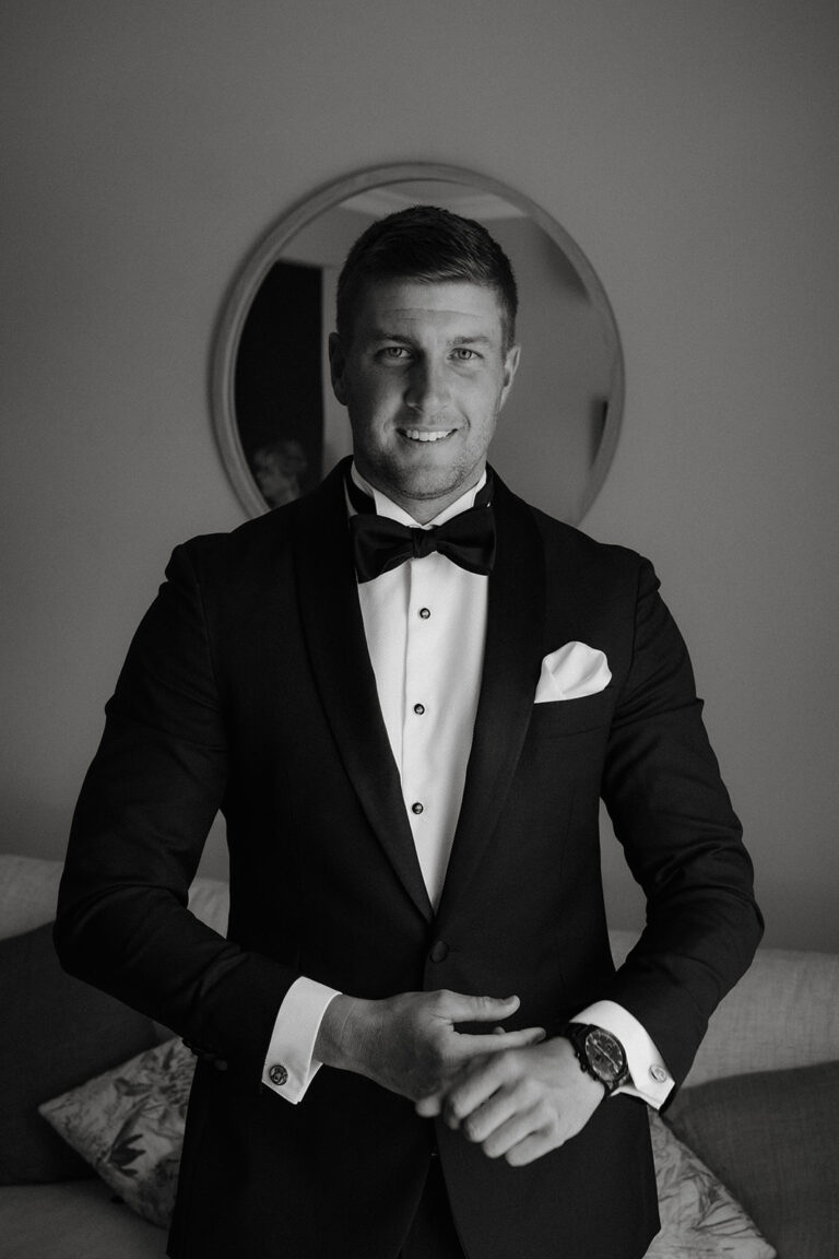 A man wearing a black tuxedo.