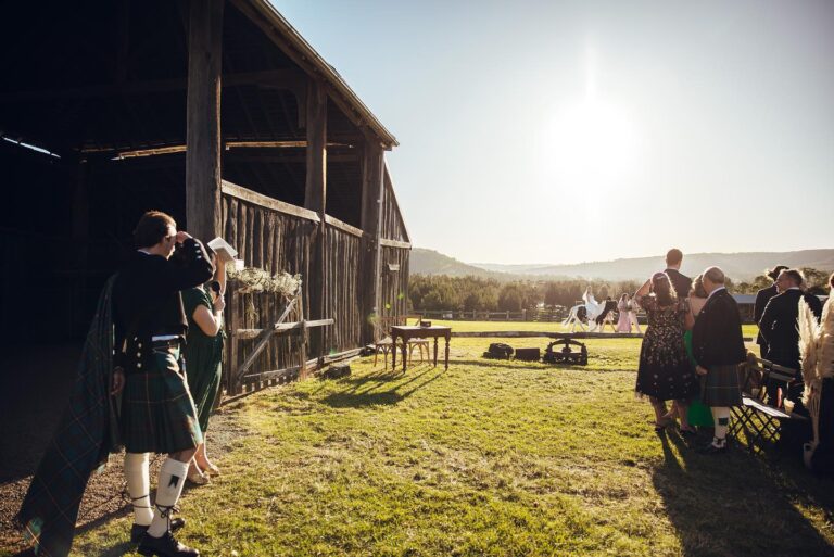 A sunny wedding ceremony at a barn.