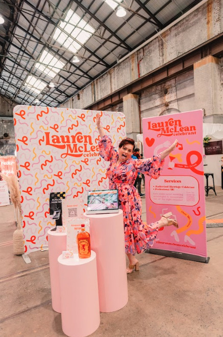A woman posing with different items from Lauren Mclean.