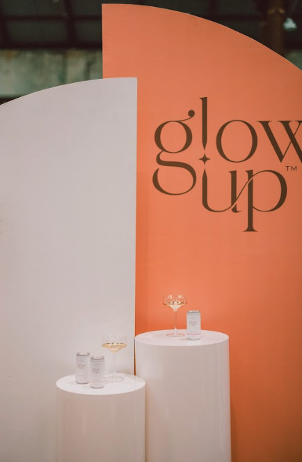 Glow up event stand: A brightly lit stand with colorful decorations, attracting attention and creating a vibrant atmosphere.