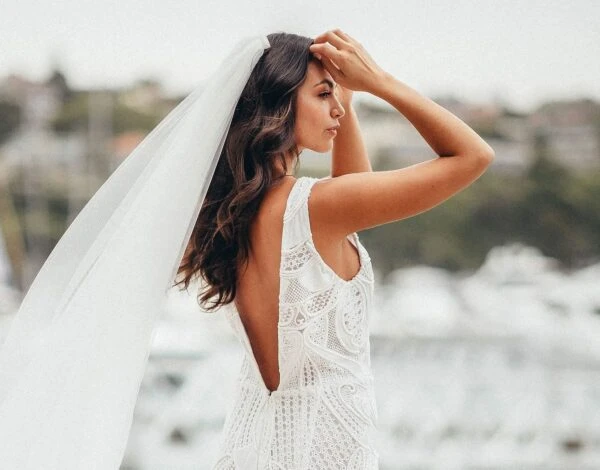 Bridesmaids Dress Listing Category Lilli Marcs bridal gown with plunging back and veil by Lilli Marcs