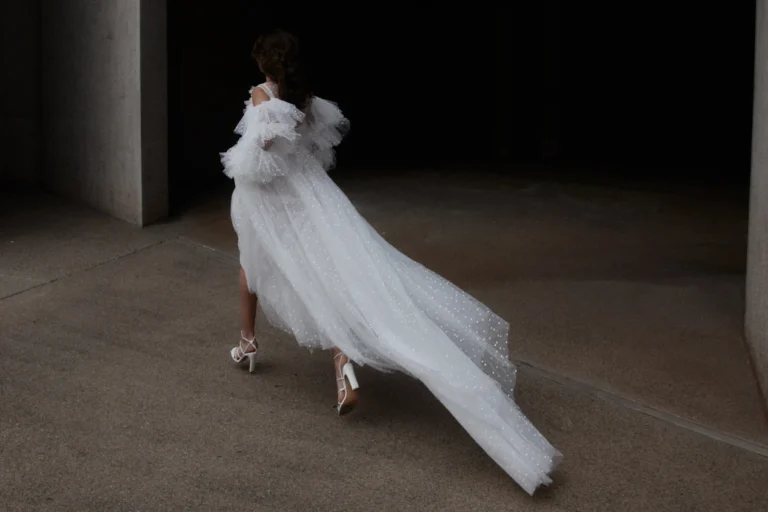 Aerial back view of a bride walking away wearing a flowing Moonstruck Bride gown, a Wedding Dress Designer in Melbourne