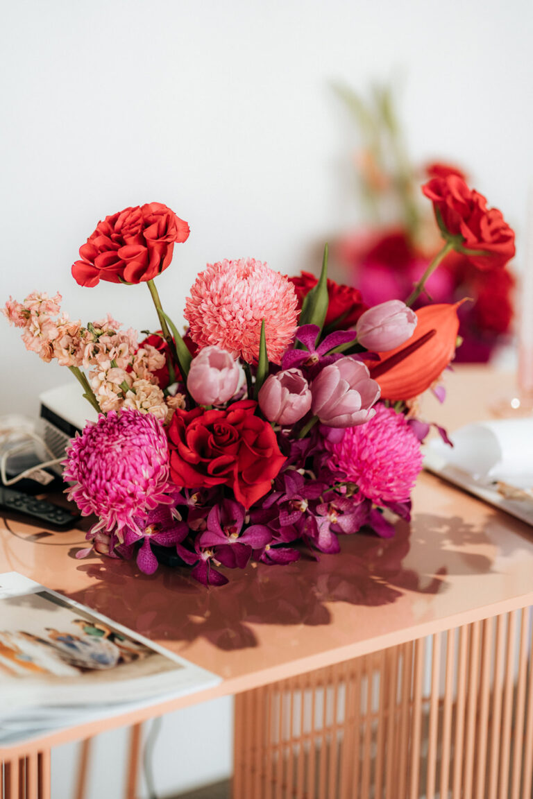 A colorful bouquet of flowers sitting on a table.