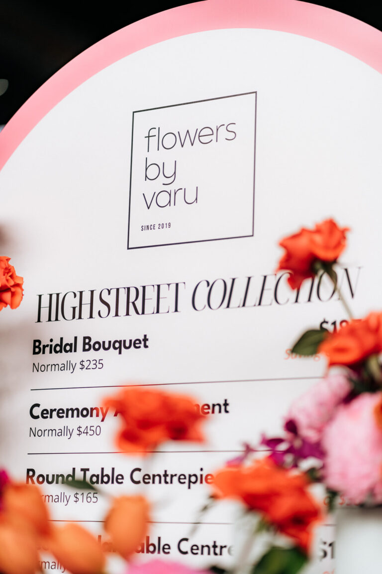 Flowers in a bridal bouquet by Yuru, featuring a mix of roses, peonies, and greenery.