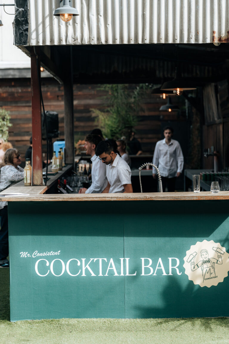 Quilted cocktail bar with cozy seating, dim lighting, and elegant decor.