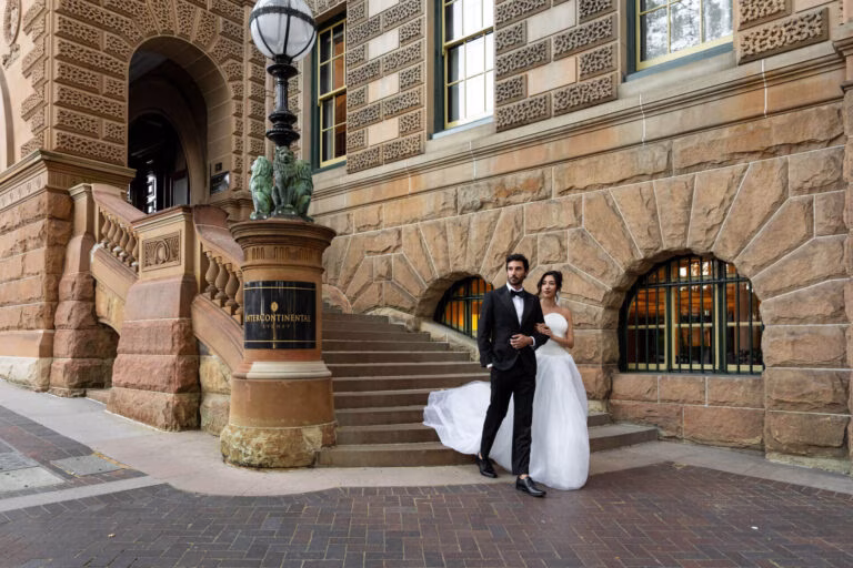 Newlywed couple walking together at InterContinental Sydney Wedding Venue in Sydney, showcasing timeless romance.